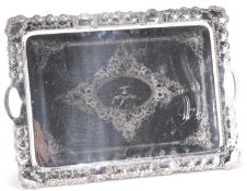 AN EDWARDIAN SILVER-PLATED TWO-HANDLED TRAY