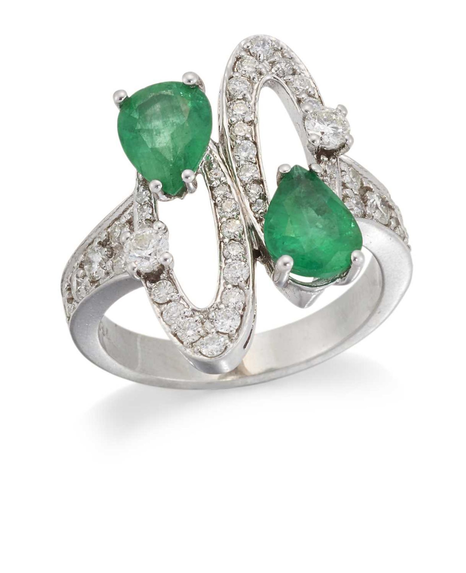 AN EMERALD AND DIAMOND DRESS RING