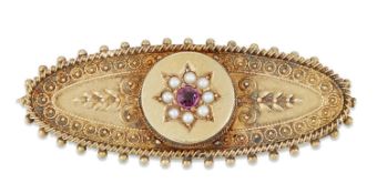 A LATE VICTORIAN 15 CARAT GOLD RUBY AND SEED PEARL BROOCH