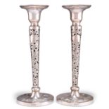 A PAIR OF CHINESE EXPORT SILVER CANDLESTICKS