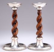 A PAIR OF GEORGE V SILVER AND OAK CANDLESTICKS