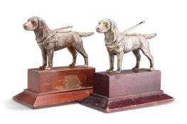 TWO SILVER-PLATED MODELS OF ASSISTANCE DOGS