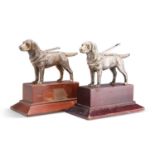 TWO SILVER-PLATED MODELS OF ASSISTANCE DOGS