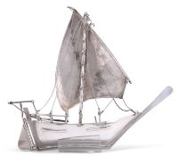 A FOREIGN SILVER MODEL OF A BOAT