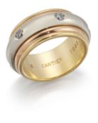 CARTIER - A TRI-COLOUR DIAMOND SPINNING RING