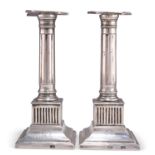 A RARE PAIR OF MEXICAN CAST SILVER CANDLESTICKS, CIRCA 1800-1810