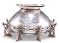 AN ARTS AND CRAFTS SILVER CANDLE HOLDER