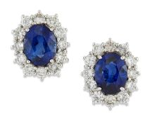 A PAIR OF 18 CARAT WHITE GOLD SAPPHIRE AND DIAMOND CLUSTER EARRINGS