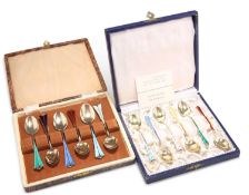 TWO CASED SETS OF SIX SCANDINAVIAN SILVER GILT AND HARLEQUIN ENAMEL COFFEE SPOONS