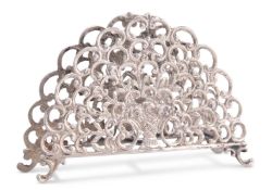 A GERMAN SILVER LETTER RACK AND AN ELIZABETH II SILVER NAPKIN RING