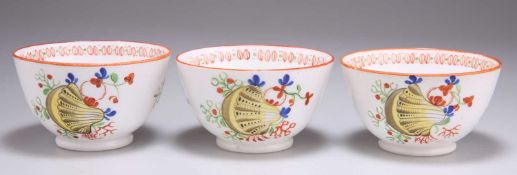 THREE EARLY 19TH CENTURY YELLOW SHELL PATTERN TEA BOWLS