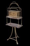 A LATE VICTORIAN BRASS AND MAHOGANY MAGAZINE RACK TABLE