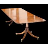 A REGENCY STYLE MAHOGANY TWIN-PEDESTAL DINING TABLE