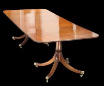 A REGENCY STYLE MAHOGANY TWIN-PEDESTAL DINING TABLE