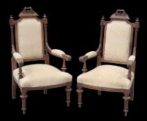 A PAIR OF VICTORIAN WALNUT ARMCHAIRS