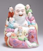A CHINESE FAMILLE ROSE FIGURE OF A LAUGHING BUDDHA AND CHILDREN