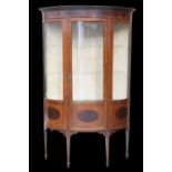 AN EDWARDIAN INLAID MAHOGANY DEMILUNE VITRINE