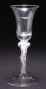 AN 18TH CENTURY OPAQUE AIR TWIST COMPOSITE STEM WINE GLASS