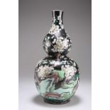 A CHINESE FAMILLE NOIRE ENAMELLED DOUBLE GOURD VASE