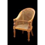 A VICTORIAN BEECH AND CANEWORK CHILD'S BERGERE CHAIR