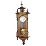 A LATE 19TH CENTURY WALNUT AND EBONISED VIENNA PATTERN WALL CLOCK