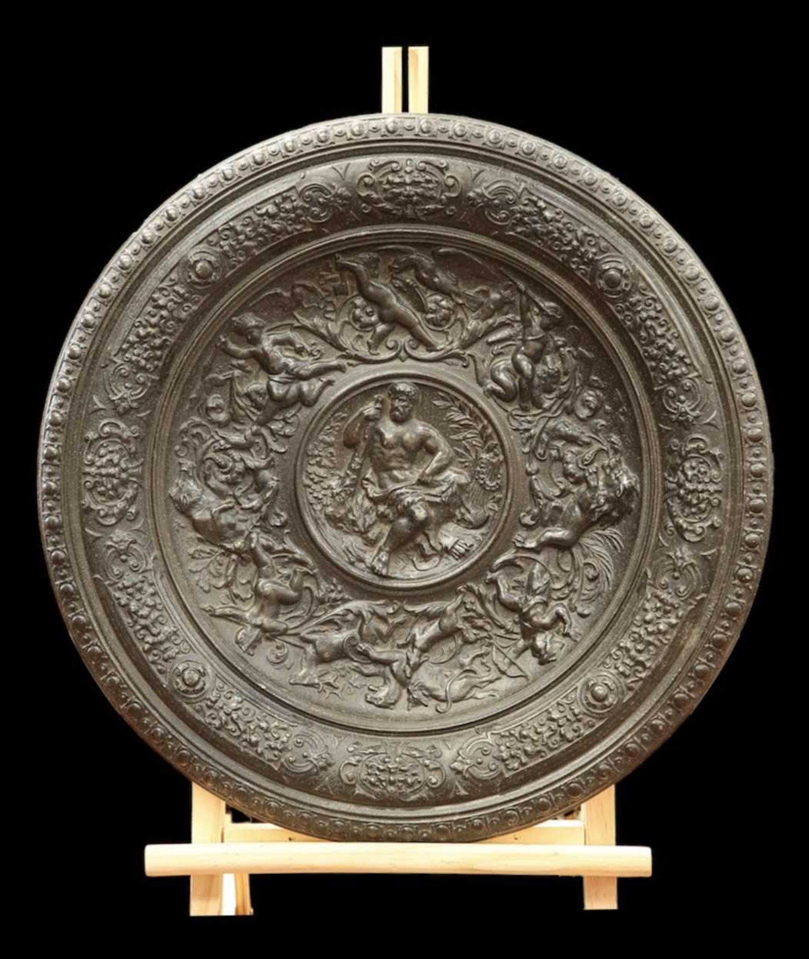 A 19TH CENTURY CAST METAL CHARGER