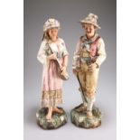 A LARGE PAIR OF EARLY 20TH CENTURY AUSTRIAN POTTERY FIGURES