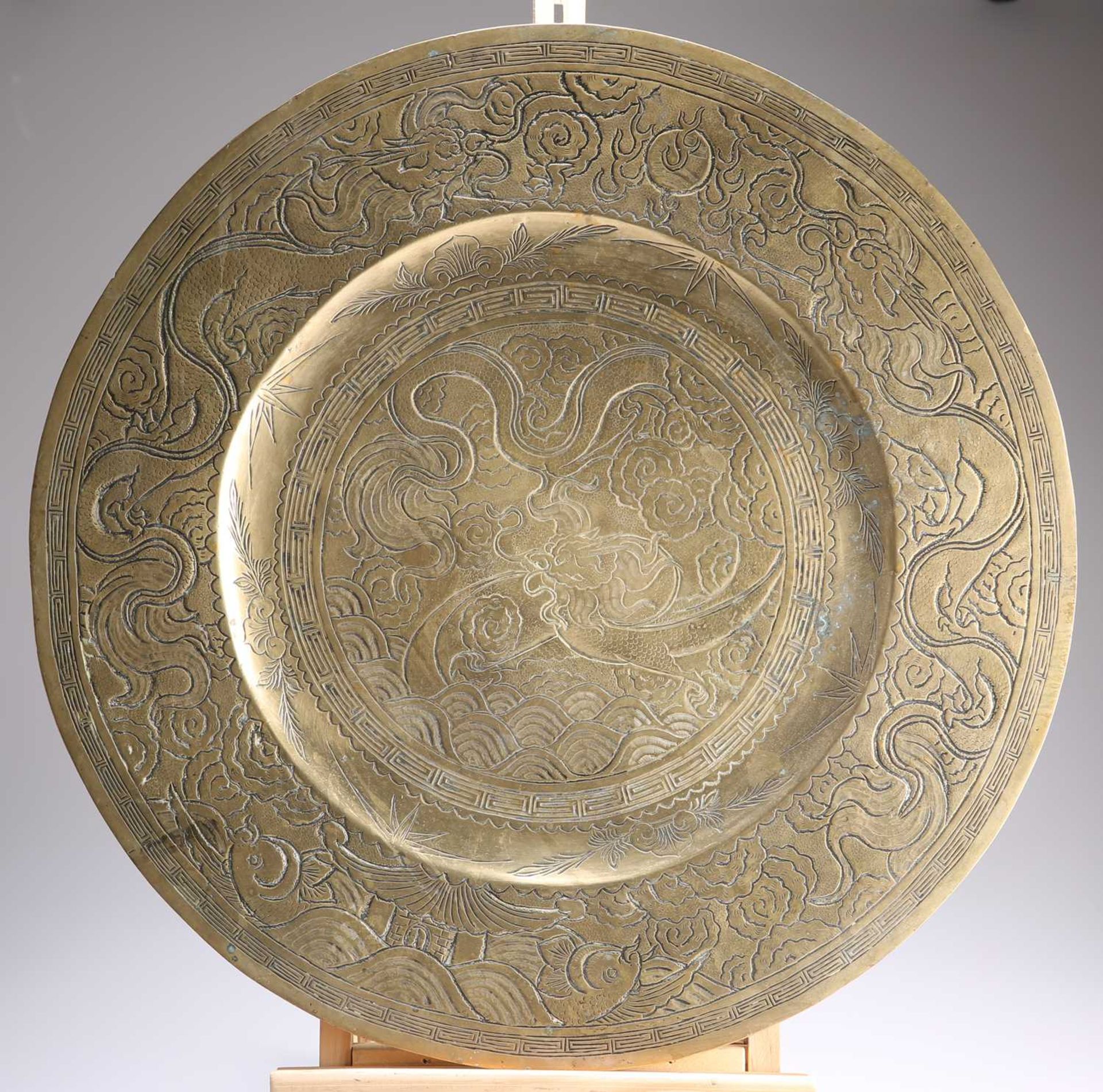 A LARGE CHINESE BRASS CHARGER
