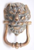 A LARGE VICTORIAN BRASS DOOR KNOCKER