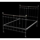 A VICTORIAN BRASS AND CAST IRON BED