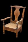 AN 18TH CENTURY OAK CHILD'S COMMODE CHAIR