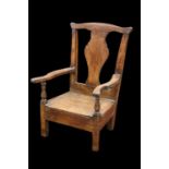 AN 18TH CENTURY OAK CHILD'S COMMODE CHAIR