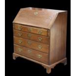 A GEORGE III OAK SLANT-FRONT BUREAU