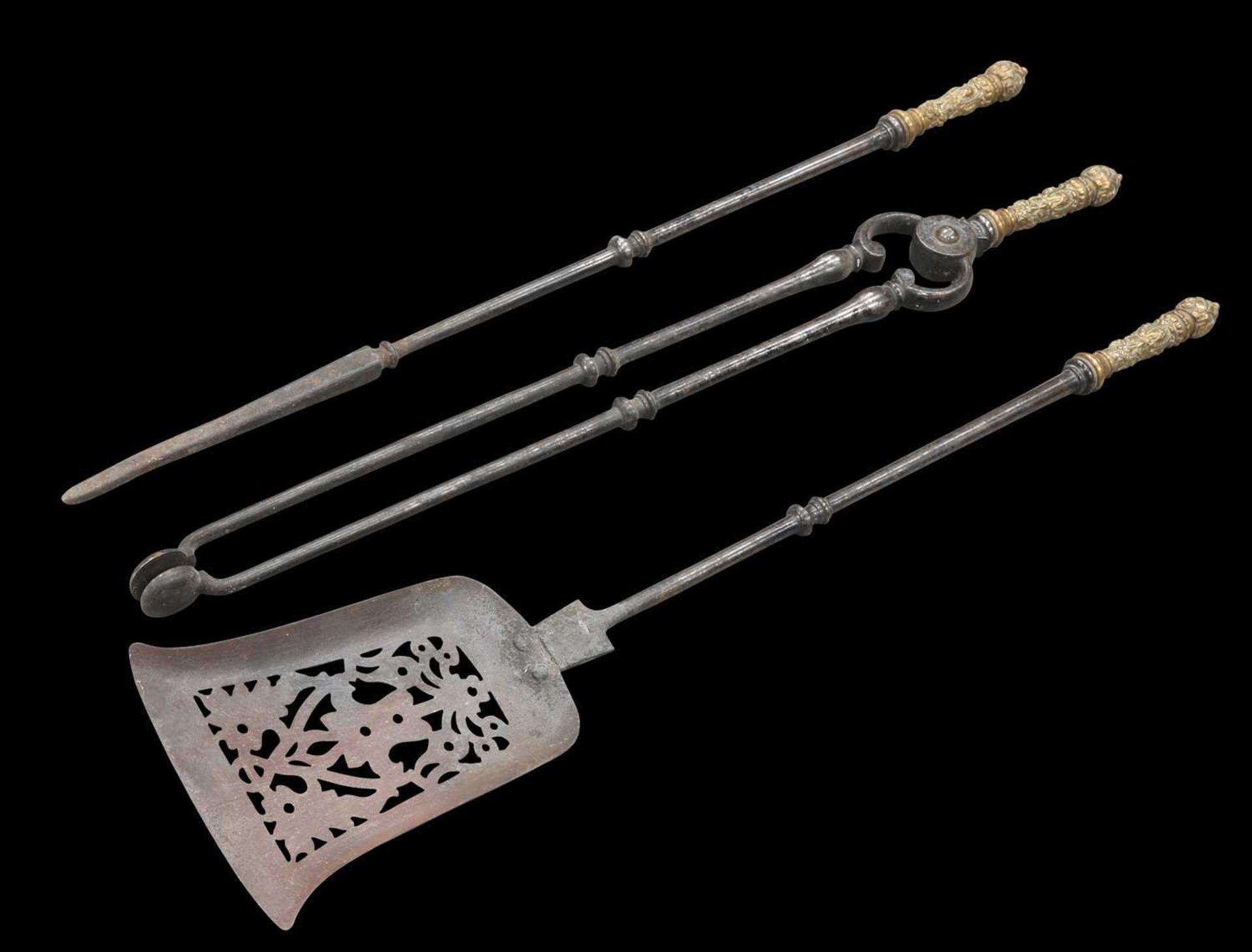 A SET OF THREE VICTORIAN STEEL AND BRASS FIRE IRONS