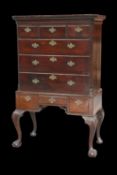 A GEORGE III MAHOGANY CHEST ON STAND