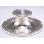 AN EDWARDIAN SILVER CAPSTAN INKWELL