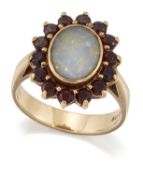 A 9 CARAT GOLD OPAL AND GARNET CLUSTER RING