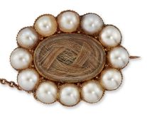 A MID 19TH CENTURY SPLIT PEARL AND HAIRWORK MOURNING BROOCH