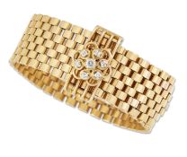 A 9 CARAT GOLD DIAMOND BUCKLE BRACELET, CIRCA 1970S