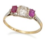 AN EARLY 20TH CENTURY DIAMOND AND RUBY THREE STONE RING