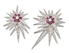 A GRADUATED PAIR OF RUBY AND DIAMOND STAR BROOCHES
