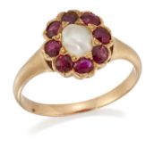 A SPLIT PEARL AND RUBY CLUSTER RING