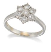 AN 18 CARAT WHITE GOLD DIAMOND CLUSTER RING