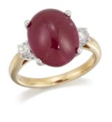 AN 18 CARAT GOLD RUBY AND DIAMOND THREE STONE RING