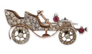 AN EARLY 20TH CENTURY NOVELTY PASTE AUTOMOBILE BROOCH