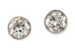 A PAIR OF SOLITAIRE OLD-CUT DIAMOND STUD EARRINGS