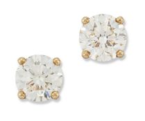 A PAIR OF 18 CARAT GOLD SOLITAIRE DIAMOND EARRINGS