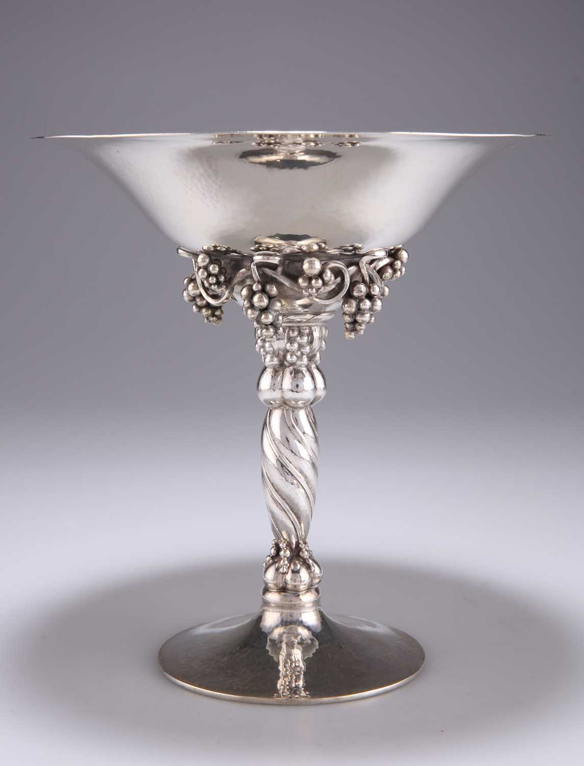 GEORG JENSEN: A DANISH STERLING SILVER 'GRAPE' PATTERN TAZZA, CIRCA 1925-30