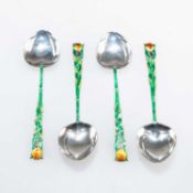 A SET OF FOUR ART DECO SILVER AND ENAMEL SPOONS