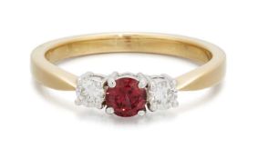 AN 18 CARAT GOLD RUBY AND DIAMOND THREE STONE RING